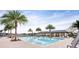 Resort-style pool area with palm trees, a covered pavilion, and ample lounge seating for relaxation at 2807 Alder Berry Blvd, Ocoee, FL 34761