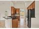 Spacious kitchen with black countertops, ample cabinetry, and stainless steel appliances at 289 Laurenburg Ln, Ocoee, FL 34761