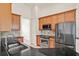Kitchen featuring stainless steel appliances, tile backsplash, and black countertops at 289 Laurenburg Ln, Ocoee, FL 34761