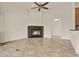 Living room showcasing a black marble fireplace with a cozy fire at 289 Laurenburg Ln, Ocoee, FL 34761