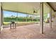 Screened-in patio with brick flooring and view of lush landscaped backyard at 289 Laurenburg Ln, Ocoee, FL 34761