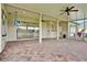 Covered patio with brick flooring, ceiling fans, and views of the outdoors at 289 Laurenburg Ln, Ocoee, FL 34761