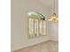 Arched window with plantation shutters letting natural light into the room at 289 Laurenburg Ln, Ocoee, FL 34761