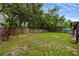 Expansive backyard enclosed by a wood fence offering plenty of room for outdoor activities at 2943 Slippery Rock Ave, Orlando, FL 32826