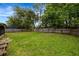 Spacious backyard featuring a well-maintained lawn and a wood fence at 2943 Slippery Rock Ave, Orlando, FL 32826