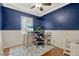 Cozy bedroom featuring a ceiling fan, and a dedicated workspace perfect for working from home at 2943 Slippery Rock Ave, Orlando, FL 32826
