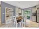 Bright dining area featuring stylish table and chairs, with convenient access to the kitchen at 2943 Slippery Rock Ave, Orlando, FL 32826