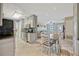Open dining area with views to the living room and featuring white cabinetry and a gray accent wall at 2943 Slippery Rock Ave, Orlando, FL 32826