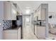Efficient kitchen with stainless steel appliances, modern cabinetry, and mosaic backsplash at 2943 Slippery Rock Ave, Orlando, FL 32826
