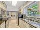 Bright kitchen features stainless appliances, granite countertops, and tile flooring at 2943 Slippery Rock Ave, Orlando, FL 32826