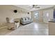 Cozy living room with tile floors, neutral décor, comfortable seating, and view to the entryway at 2943 Slippery Rock Ave, Orlando, FL 32826