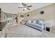 Relaxing living room with comfortable seating, tile flooring, and seamless flow to the kitchen at 2943 Slippery Rock Ave, Orlando, FL 32826
