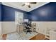 Home office featuring hardwood floors, natural light, and modern desk setup at 2943 Slippery Rock Ave, Orlando, FL 32826