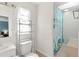 A bright bathroom featuring a toilet and a tub with shower curtain at 3232 Butterfield St, Deltona, FL 32738