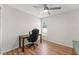 Spacious bedroom featuring wood flooring, a ceiling fan, and desk near the window at 3232 Butterfield St, Deltona, FL 32738