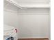 A walk-in closet with white walls, shelving, and a wooden floor at 3232 Butterfield St, Deltona, FL 32738