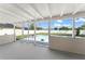 Covered patio overlooking the in-ground pool and fenced backyard at 3232 Butterfield St, Deltona, FL 32738