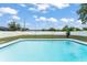Backyard featuring an in-ground pool with clean water and a white privacy fence at 3232 Butterfield St, Deltona, FL 32738