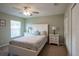 Cozy bedroom with neutral paint, ceiling fan and carpet flooring at 32937 Scenic Hills Dr, Mount Dora, FL 32757