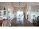 Open-concept dining area with wood floors connecting to living spaces, brightened by natural light at 32937 Scenic Hills Dr, Mount Dora, FL 32757