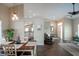 Open dining and living area with wood floors, transitional decor, and great natural light at 32937 Scenic Hills Dr, Mount Dora, FL 32757
