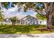 Charming single-story home with a well-manicured lawn, mature trees, and inviting curb appeal at 32937 Scenic Hills Dr, Mount Dora, FL 32757