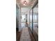 Hallway between the bedroom and bathroom has a mirrored closet at 32937 Scenic Hills Dr, Mount Dora, FL 32757