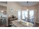 Bright kitchen featuring granite countertops, modern appliances, and an adjacent breakfast area with natural light at 32937 Scenic Hills Dr, Mount Dora, FL 32757