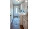 Functional laundry room with washer, dryer, and granite countertop at 32937 Scenic Hills Dr, Mount Dora, FL 32757