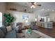 Cozy living area featuring comfortable seating, vaulted ceilings, and an open layout to the kitchen at 32937 Scenic Hills Dr, Mount Dora, FL 32757