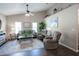 Cozy living room with vaulted ceiling, fan, and neutral colors at 32937 Scenic Hills Dr, Mount Dora, FL 32757