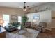 Comfortable living room boasts vaulted ceiling, ceiling fan and lots of light at 32937 Scenic Hills Dr, Mount Dora, FL 32757