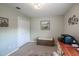 Comfortable home office space features natural light, closet, and storage bench at 32937 Scenic Hills Dr, Mount Dora, FL 32757