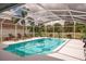 Refreshing screened pool area with lounge chairs, perfect for relaxation and leisure at 32937 Scenic Hills Dr, Mount Dora, FL 32757