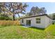 Nice backyard features a new fence, a grassy area and sliding glass doors to the house at 3672 Rollin O Ln, Apopka, FL 32703