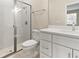 Modern bathroom featuring a glass-enclosed shower and a white vanity with solid surface countertop at 3672 Rollin O Ln, Apopka, FL 32703