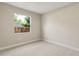 Bright, carpeted bedroom with natural light streaming through the window at 3672 Rollin O Ln, Apopka, FL 32703