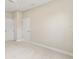 Carpeted bedroom with two closets, a door, and neutral walls and baseboards at 3672 Rollin O Ln, Apopka, FL 32703