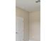 A simple, clean bedroom featuring neutral-toned walls and white trim and door at 3672 Rollin O Ln, Apopka, FL 32703