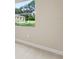Bright bedroom featuring neutral walls, plush carpet, and a large window with a green view at 3672 Rollin O Ln, Apopka, FL 32703