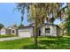 Charming single-story home with a well-maintained lawn, a two-car garage, and curb appeal at 3672 Rollin O Ln, Apopka, FL 32703