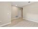 A spacious living room with laminate flooring and white baseboards and neutral wall paint at 3672 Rollin O Ln, Apopka, FL 32703