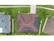 Birds-eye view of a home featuring a brown roof and solar panels at 3813 Blue Dasher Dr, Kissimmee, FL 34744