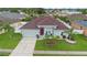 Beautiful home with a well-kept lawn, red front door, and a two-car garage at 3813 Blue Dasher Dr, Kissimmee, FL 34744