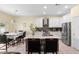 Modern kitchen with white cabinets, an island with seating, and stainless steel appliances at 3813 Blue Dasher Dr, Kissimmee, FL 34744