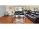 Comfortable living area with stylish furniture, wood floors, and decorative accents at 3813 Blue Dasher Dr, Kissimmee, FL 34744