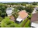 Aerial view of a home showcasing its landscaped yard, screened lanai, and fenced perimeter at 4110 Boca Woods Dr, Orlando, FL 32826