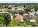 Scenic aerial perspective of the home, highlighting the serene pond and neighborhood surroundings at 4110 Boca Woods Dr, Orlando, FL 32826
