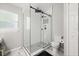 Bright bathroom with a large walk-in shower featuring a modern design and contrasting tile at 4110 Boca Woods Dr, Orlando, FL 32826