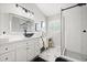 Stylish bathroom with a modern vanity, sleek mirror, and walk-in shower with black hardware at 4110 Boca Woods Dr, Orlando, FL 32826